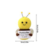 Handmade crochet positive bee doll with a smiling face and an inspirational slogan
