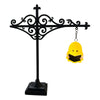 Black wrought iron antique library lantern with a yellow owl light fixture hanging from it