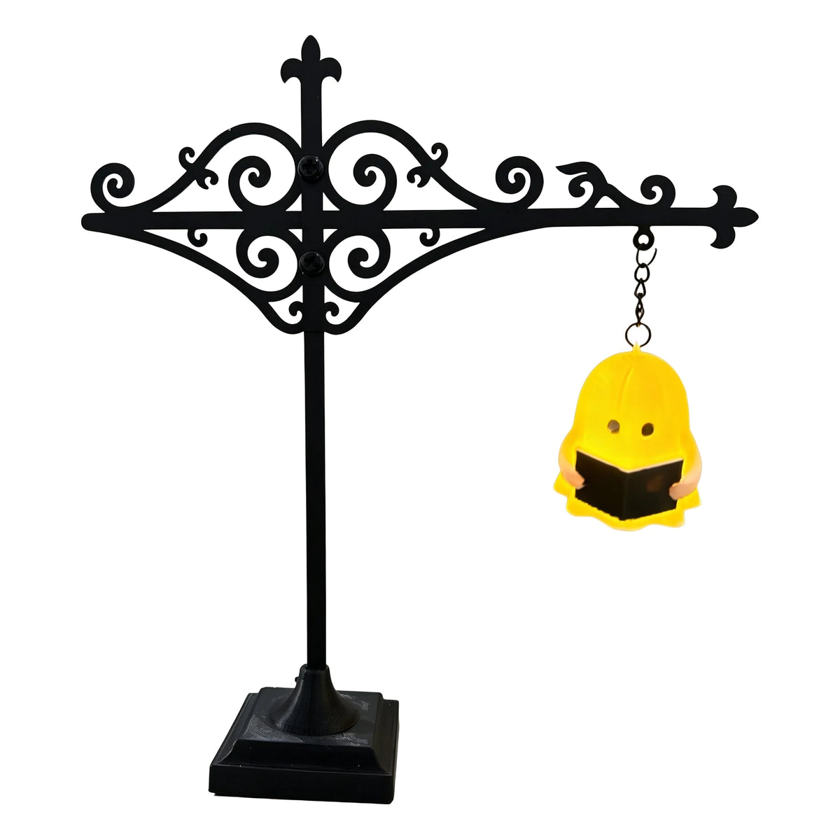 Black wrought iron antique library lantern with a yellow owl light fixture hanging from it