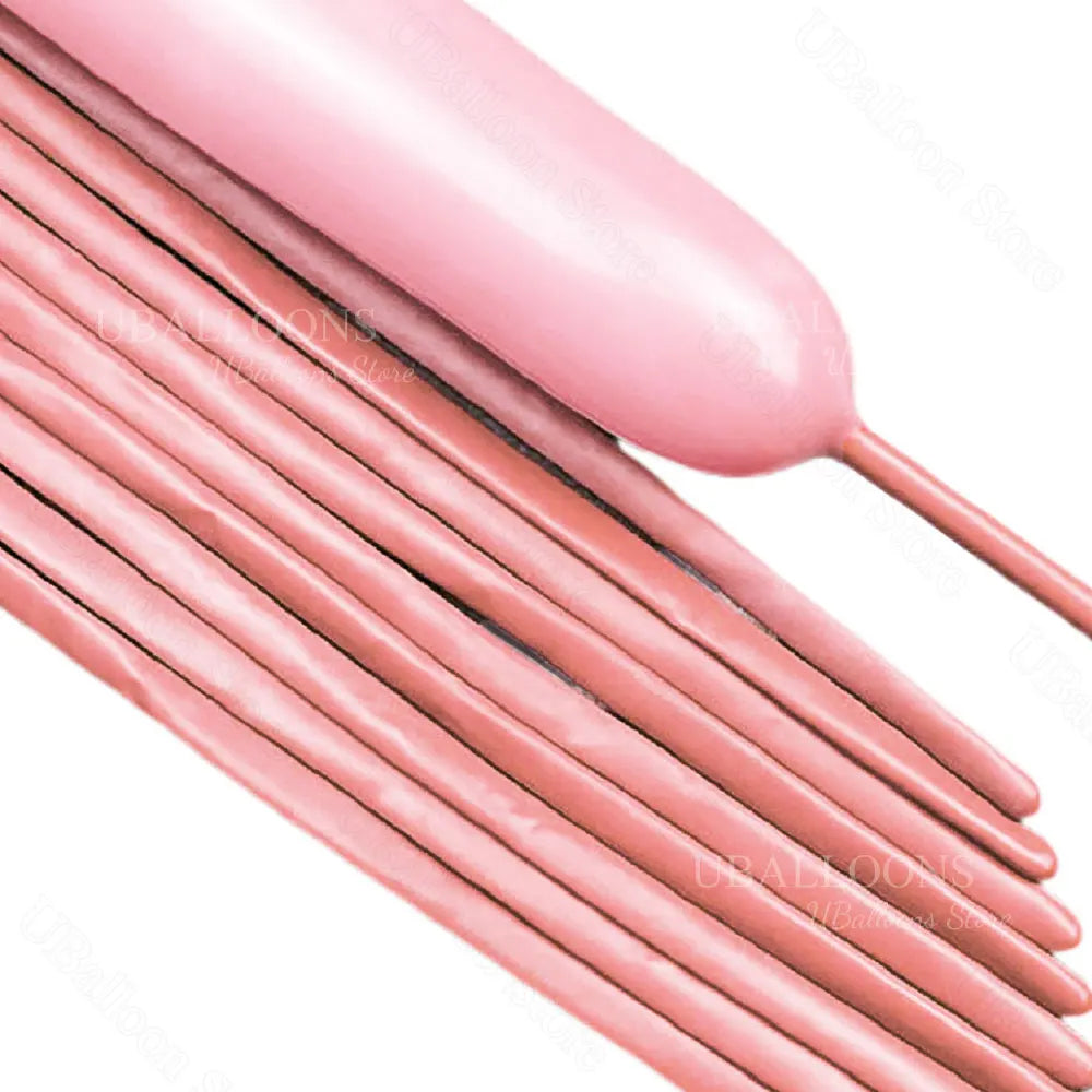 A close-up of pink magic twisting balloons arranged in a fan shape.