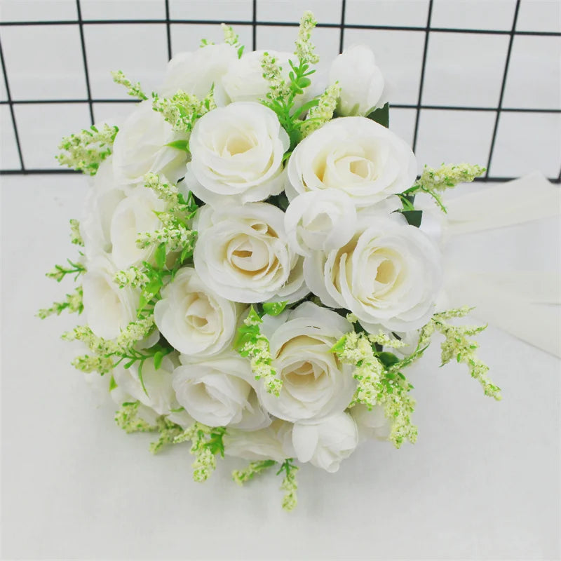 Elegant white silk rose bridal bouquet featuring creamy white roses and delicate green filler flowers