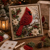 A framed 3D fabric poke art kit featuring a red bird in a winter forest scene with snow and greenery.