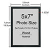 A black wooden picture frame with a gray mat displaying the text 5x7 Photo Size Wood Material