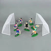 White geometric field decor with colorful soccer players and a ball cake toppers