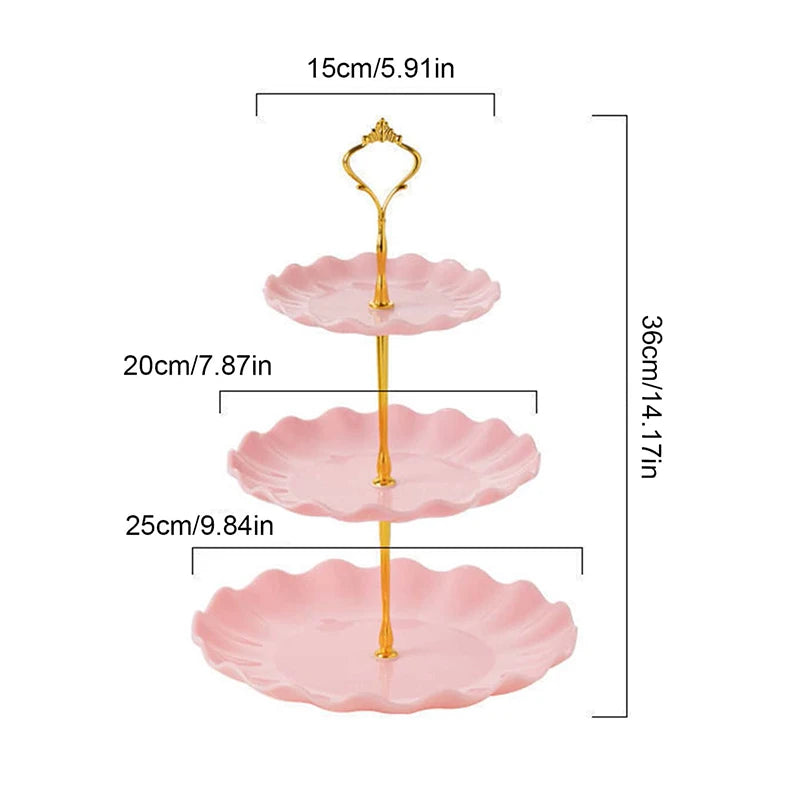 A two-tier serving stand with gold accents, featuring three pink, scalloped plates for desserts or fruit.