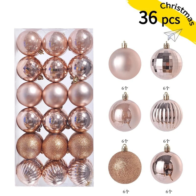A set of 36 festive pink and gold Christmas baubles for holiday tree and decor.