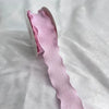 Pink decorative fishtail yarn ribbon displayed on a white background.
