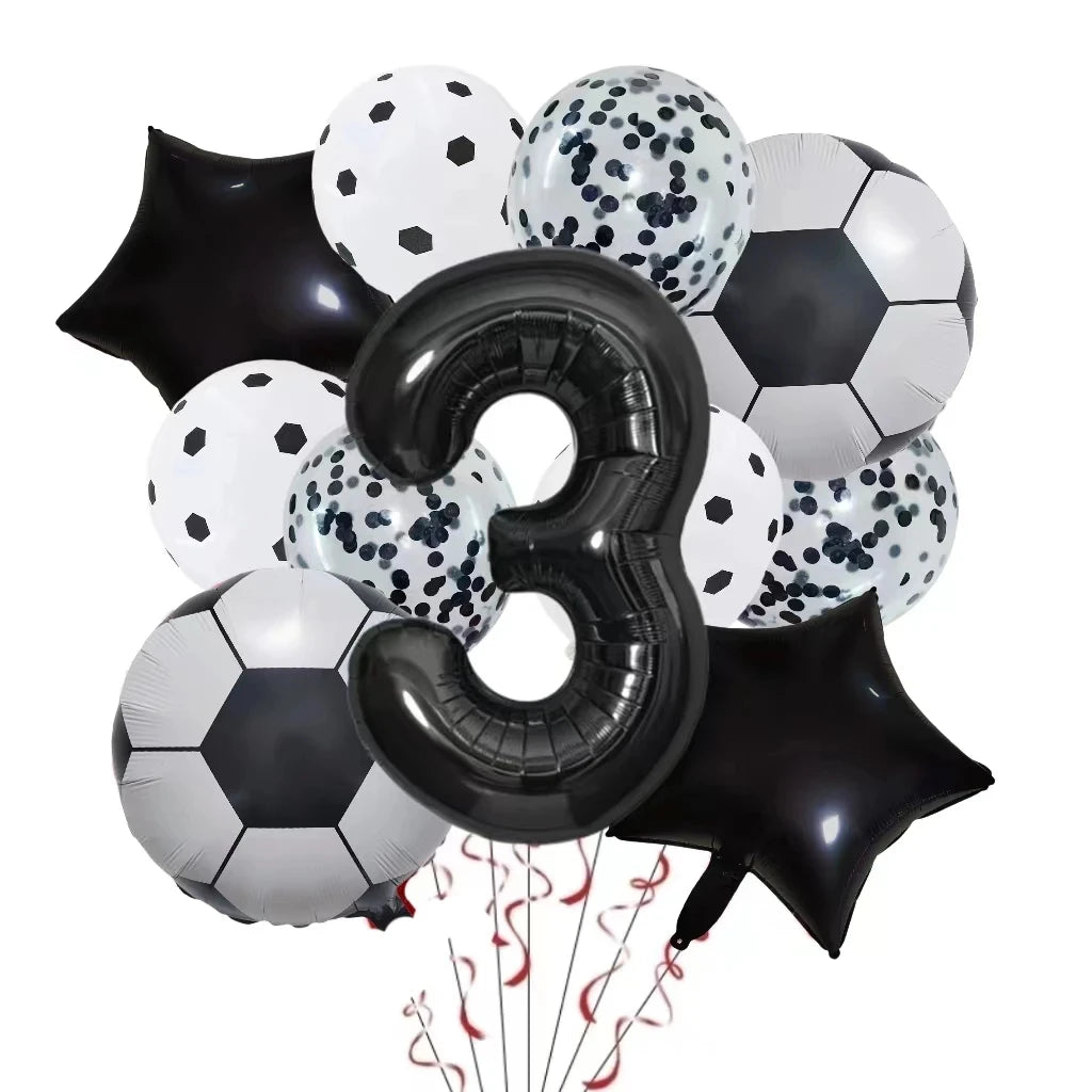 A collection of black and white football-shaped helium foil balloons, including a large number three balloon.