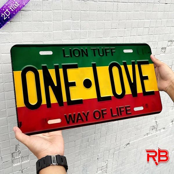 A black metal wall sign with yellow and red stripes featuring the text ONE LOVE and WAY OF LIFE.