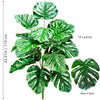 Artificial Monstera plant with silk green leaves shown in a full view.