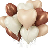 A cluster of glossy heart-shaped foil balloons in shades of rose gold and cream.