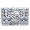 A box containing a 102-piece silver and glitter Christmas ornament set with a star tree topper.
