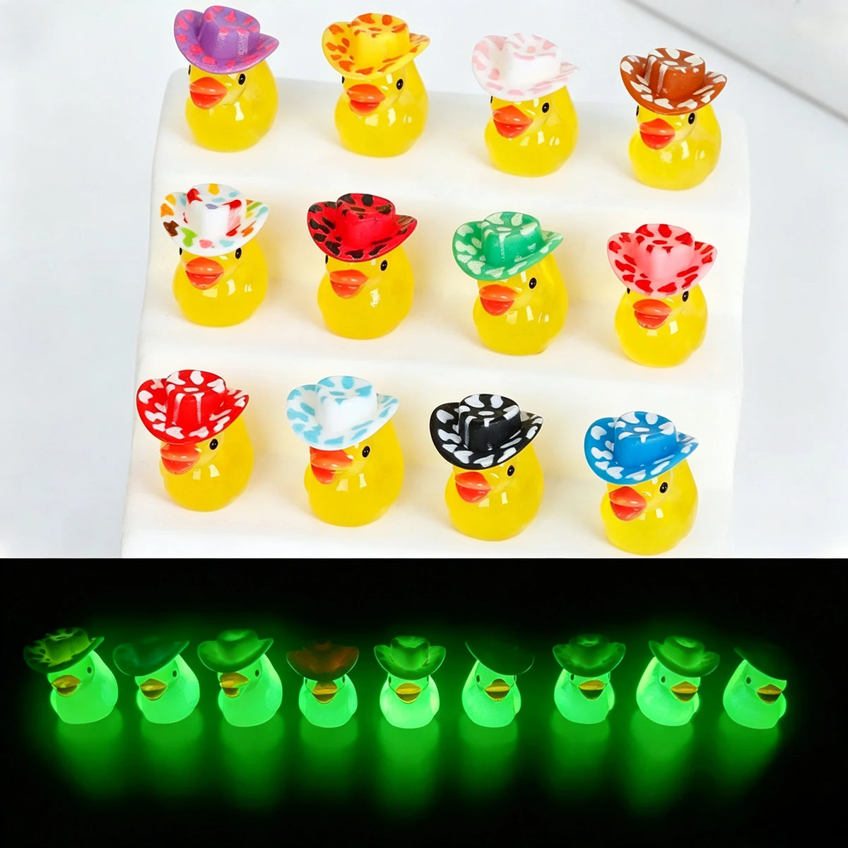 A display of ten glow-in-the-dark resin duck figurines with colorful hats arranged in a grid.