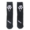 Pair of black novelty crew socks featuring skull, alien, and tiger prints