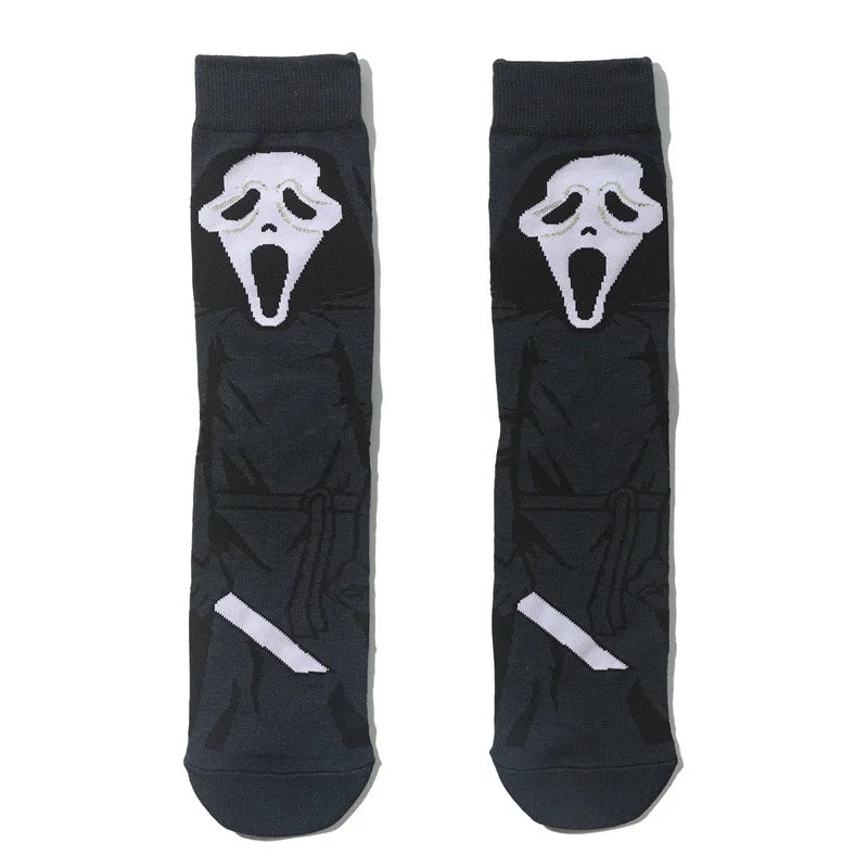 Pair of black novelty crew socks featuring skull, alien, and tiger prints