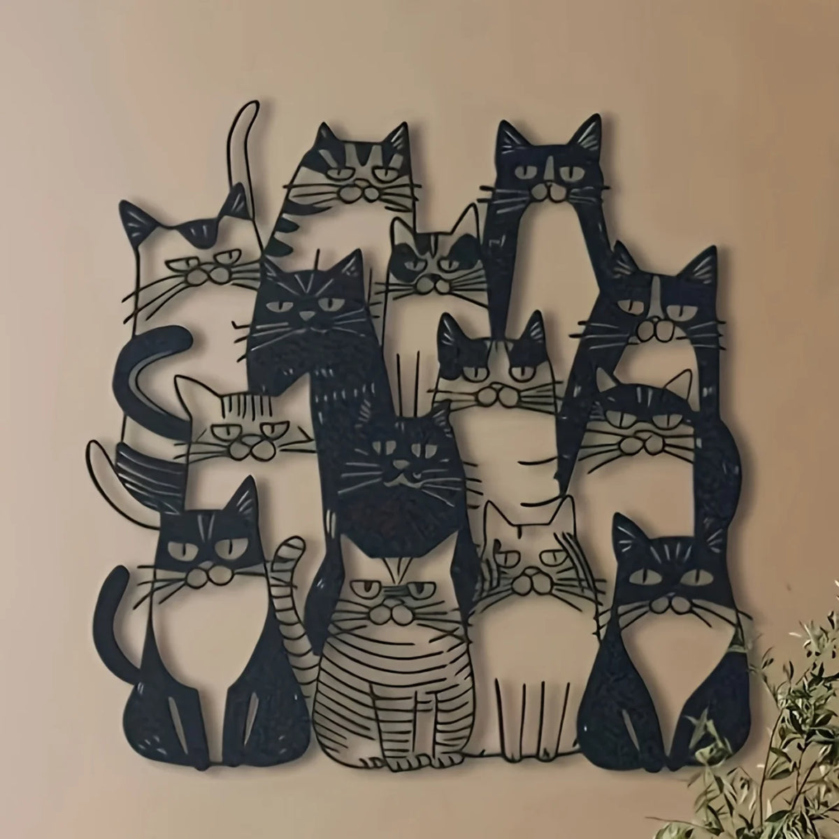 Black silhouette wall art featuring multiple cats in various poses and styles