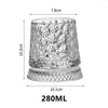 A clear crystal whiskey glass with a relief pattern, measuring 7.8cm tall and 10.1cm wide, with a 280ml capacity.