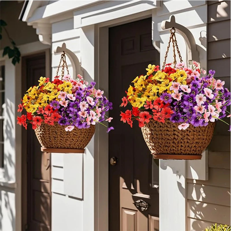 Two hanging baskets filled with mixed colorful artificial flowers on a white door