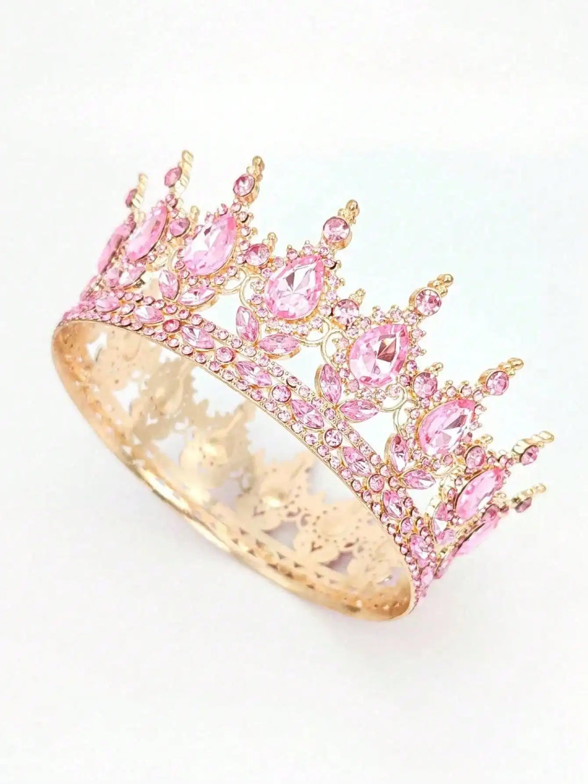 Gold-toned crystal rhinestone crown with pink stones and leaves.