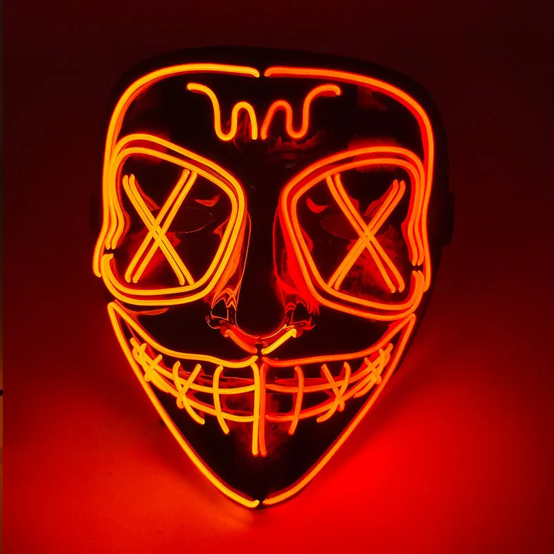 A glowing orange LED mask resembling a stylized face with crossed eyes and a wide grin.