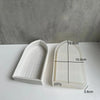 White silicone mold shaped like a church window for crafting resin or plaster