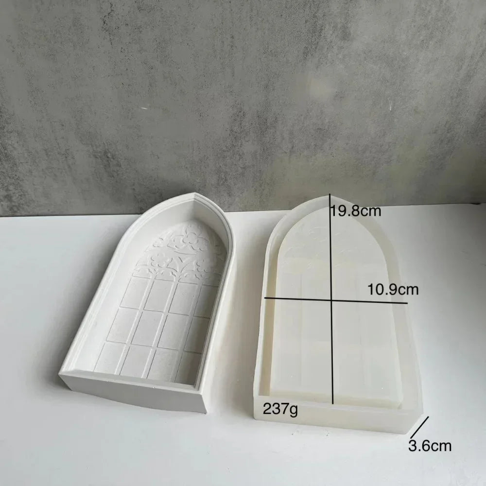 White silicone mold shaped like a church window for crafting resin or plaster