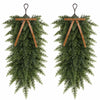 Artificial Christmas teardrop swag made of green evergreen foliage with wooden ribbon ties