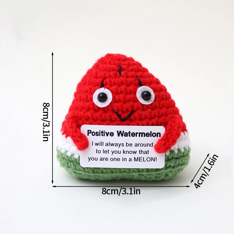 Handmade crochet positive watermelon doll with a smiling face and an inspirational slogan tag