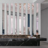 Acrylic mirror strip wall stickers reflecting light in a modern interior setting