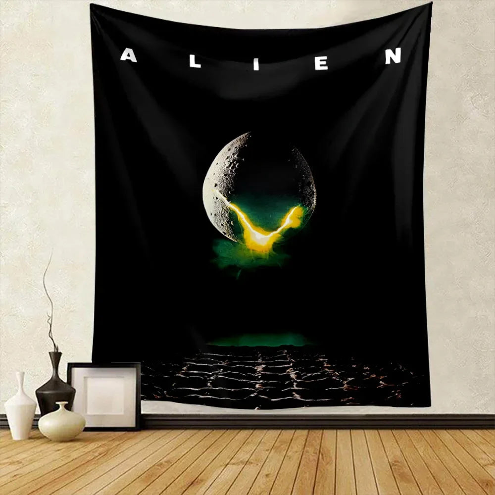 Black tapestry featuring a glowing green planet with a yellow atmosphere and the word ALIEN above it.