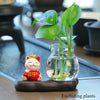 Mini resin desk ornament featuring a green ivy plant and a small white lucky cat in a glass vase.
