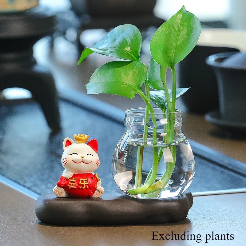 Mini resin desk ornament featuring a green ivy plant and a small white lucky cat in a glass vase.