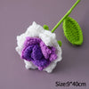 Handmade crochet tulip bouquet featuring white petals and purple center with green stem
