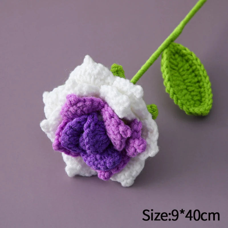 Handmade crochet tulip bouquet featuring white petals and purple center with green stem