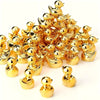 A pile of small golden duck resin statues.