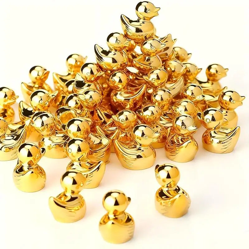 A pile of small golden duck resin statues.