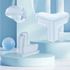 Clear silicone corner protectors for baby safety displayed on a light blue background.
