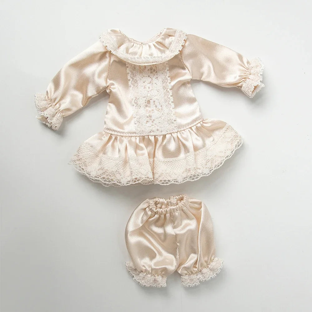 Vintage lace pajama set for a doll featuring satin fabric and delicate lace trim