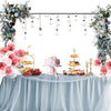 A decorative balloon arch stand with hanging balloons and floral arrangements for parties and events