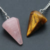 A silver chain necklace featuring two polished natural stone pendants, one pink quartz and one golden-brown jasper.