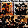 A black balloon garland arch kit with various balloons and decorations for parties.