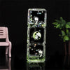 A clear glass hourglass filled with liquid sand featuring cute panda designs.
