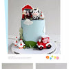 A tiered cake decorated with farm animal toppers including a cow, sheep, and pig.