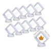 A set of ten white floating shadow box jewelry display frames with clear acrylic and white bases.