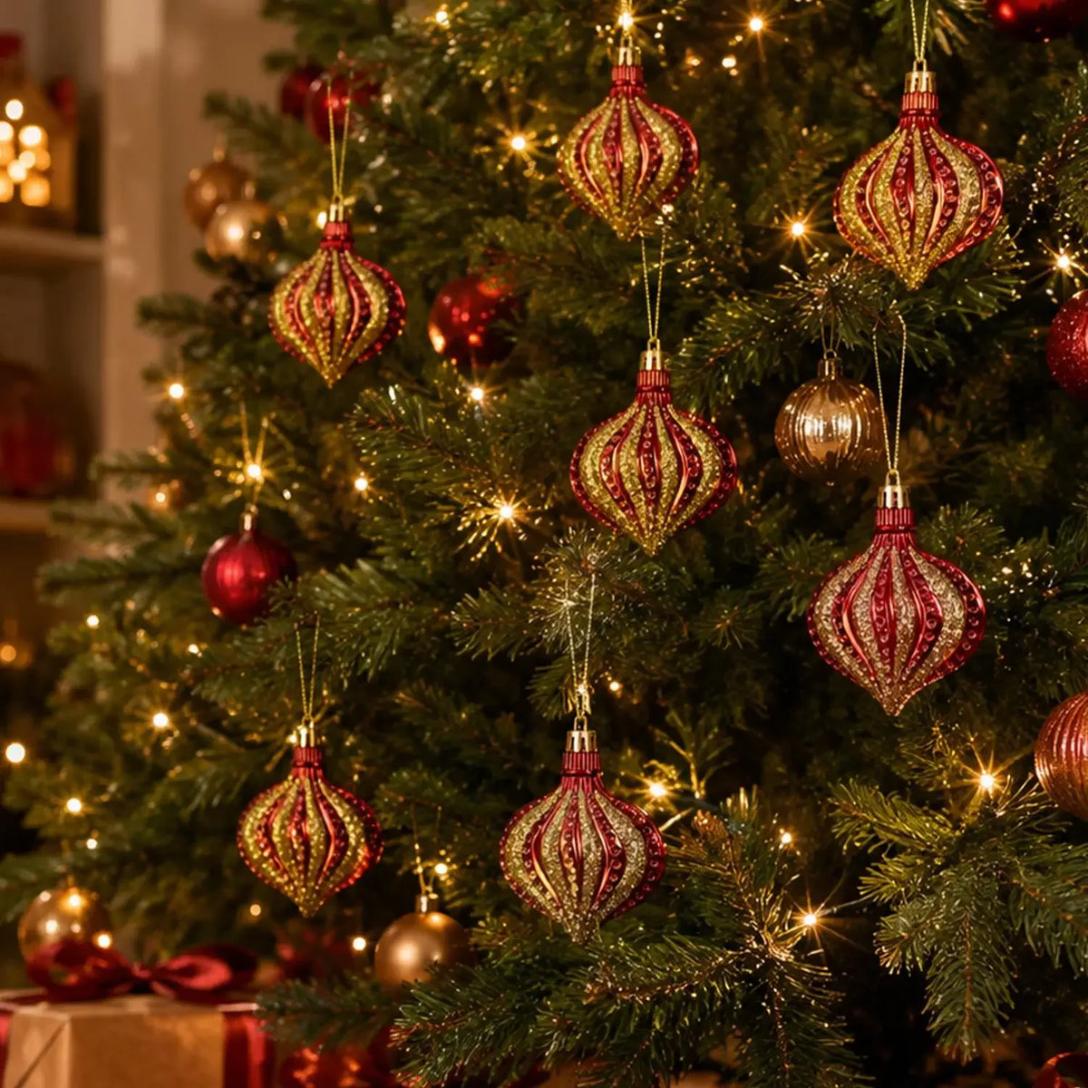 A close-up of a decorated Christmas tree with shiny red and gold spherical ornaments.