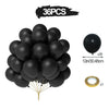 A bunch of 36 black balloons with gold confetti accents and a gold straw for party decor.