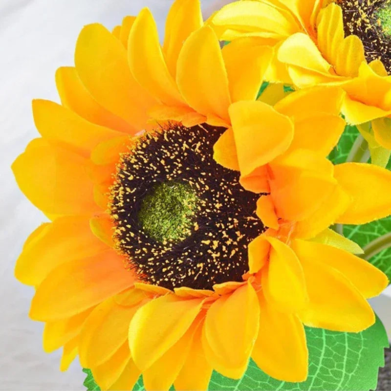 A bright yellow sunflower flower with a dark center is shown, likely used as an LED night light.