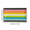A rectangular pin holder displaying a row of colorful pride flags in shades of pink, orange, yellow, green, blue, and teal.
