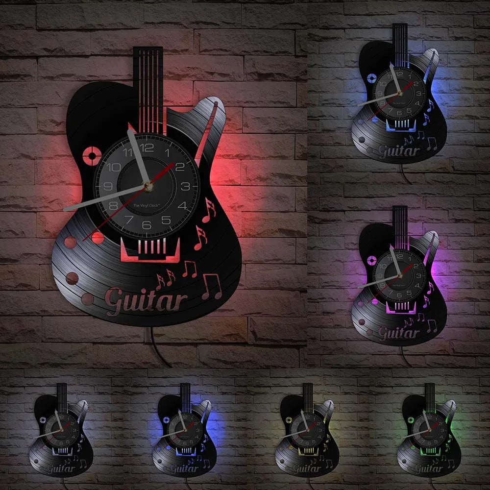 A collection of vintage vinyl record guitar wall clocks displayed against a brick background.