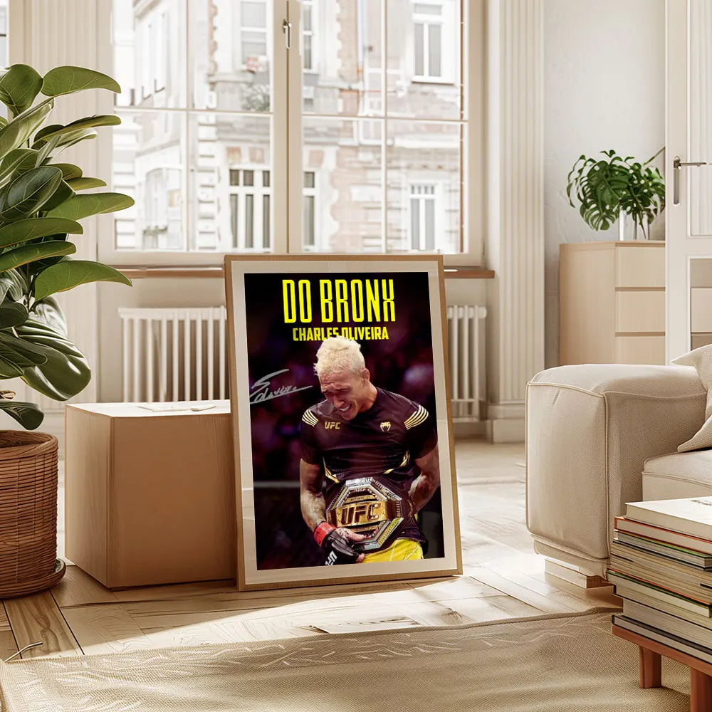 A framed poster featuring Charles Oliveira in a UFC fight, displayed indoors.